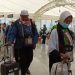 Sejumlah jamaah haji asal Indonesia berjalan di area terminal sebelum diberangkatkan dari Makkah ke Madinah dan Jeddah, dalam rangka pemulangan jamaah haji gelombang kedua, Sabtu (21/6/2025). (Dok, mui.or.id)
