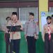 Kapolresta Jambi Kombes Pol Boy Sutan Binanga Siregar memimpin Apel Serentak Gerakan Pramuka Goes to School di halaman SMP Negeri 6 Kota Jambi, Senin (21/7/2025). (Dok. Daus)