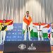 "Bripda Farel Patra Syaifullah (kiri) dari Polda Jambi mengibarkan bendera Merah Putih usai meraih medali perak di ajang World Police and Fire Games (WPFG) 2025 kategori Senior Men Under 68 Kg di Birmingham, Alabama, Amerika Serikat." (Dok. Humas Polda)