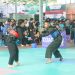 Dua pesilat saling adu strategi pada hari kedua Open Turnamen Pencak Silat Piala Danrem 042/Gapu di Lapangan Tenis Indoor Korem 042/Gapu, Jambi, Sabtu (10/8/2025). (Dok.Nahar)