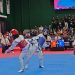 Dua atlet taekwondo berlaga sengit pada pertandingan PON Bela Diri 2025 di GOR Djarum, Kudus, Jawa Tengah. Kontingen Jambi menurunkan 16 atlet dari empat cabang olahraga bela diri dengan target menambah perolehan medali. (Dok. Koni Jambi)