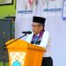 Wagub Sani menyampaikan sambutan saat penyerahan Bantuan Dumisake Pendidikan kepada pelajar SMA, SMK, dan SLB di SMA Negeri 1 Tanjab Barat, Sabtu (29/11/2025). Dok. Erit - Kominfo)