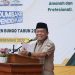 Gubernur Jambi Al Haris memberikan sambutan saat meresmikan SMK Negeri Titian Teras Bungo dan menyerahkan bantuan Dumisake Pendidikan di Kabupaten Bungo, Kamis (4/12/2025). (Dok, Erit - Kominfo)