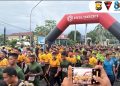 Personel Brimob Polda Bengkulu turut ikuti kegiatan Fun Run HUT Korem yang digelar di Kota Bengkulu, Sabtu (14/2/2026). (Dok/yola)