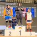 Atlet angkat besi Jambi, Juliana Klarisa (tengah), berdiri di podium juara usai meraih medali emas pada Kejuaraan Nasional Angkat Besi 2026 di Bandung, Jawa Barat. (Dok. Humas)
